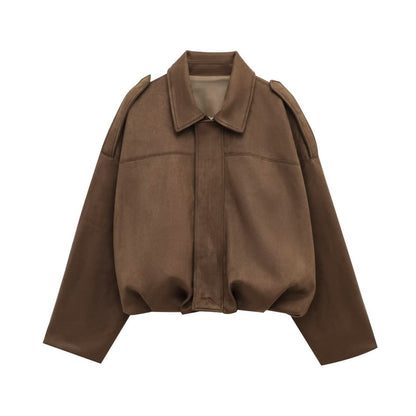 Close-up of brown suede jacket texture and shoulder detail
