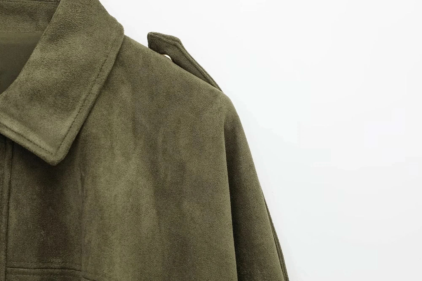 Close-up of brown suede jacket texture and shoulder detail