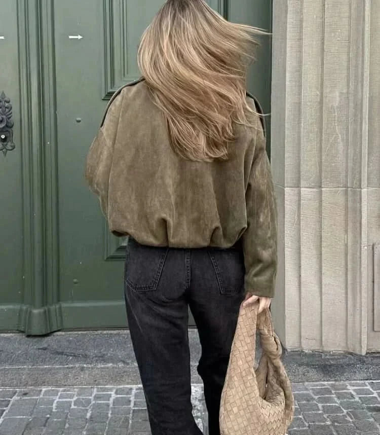 Back view of olive suede jacket showing relaxed fit and shoulder details