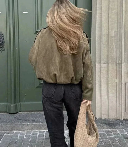 Back view of olive suede jacket displaying oversized silhouette