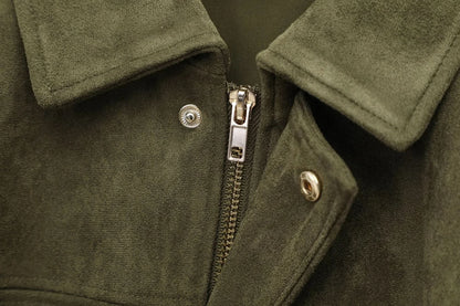 Close-up of silver metal zipper and snap button on olive suede jacket