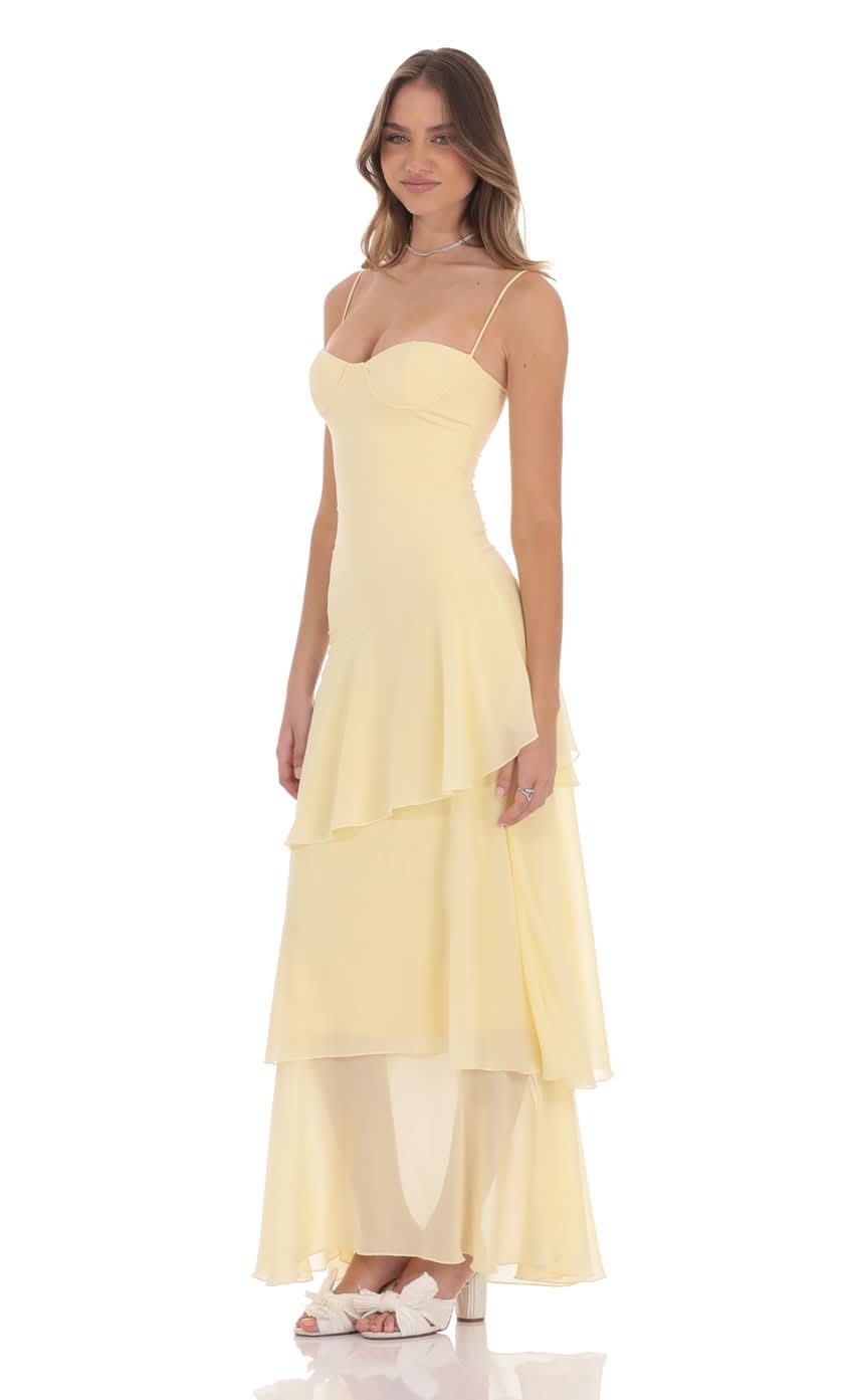 Yellow chiffon maxi dress showing side view of tiered ruffle layers and fitted bodice
