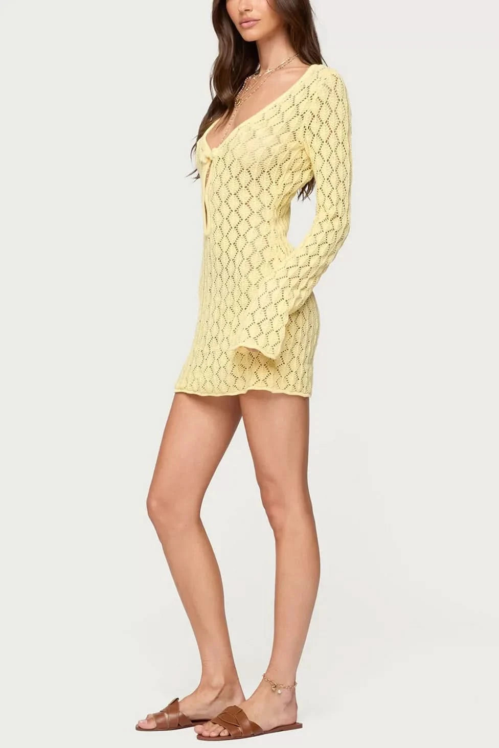Yellow crochet mini dress with v-neckline and long sleeves side view
