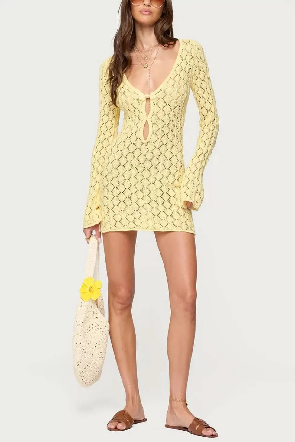 Yellow crochet mini dress with front tie closure and bell sleeves