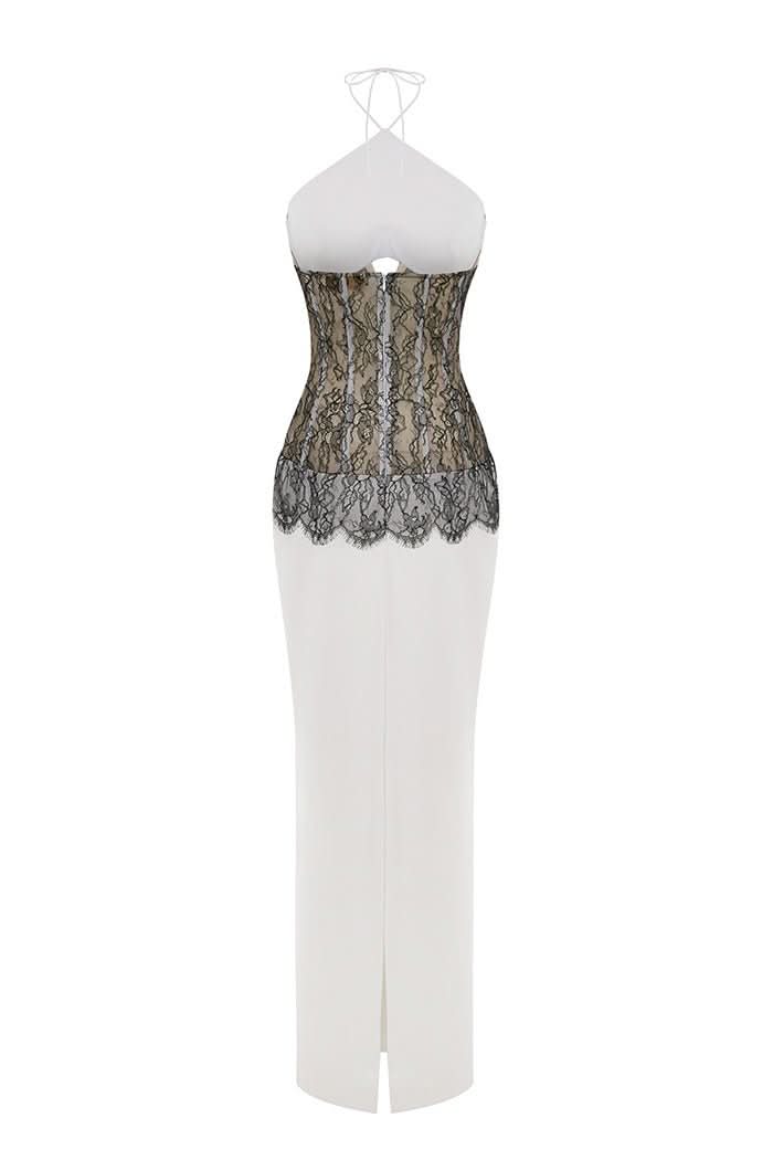 Back view of white maxi dress with black lace waist detail and front slit