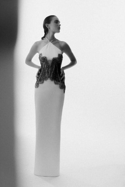 Front view of white maxi dress with black lace corset top and halter straps
