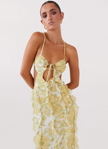 Yellow floral ruffle maxi dress with bow cut-out and open back design for women