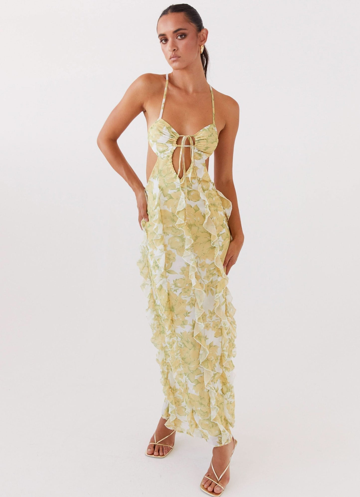 Yellow floral ruffle maxi dress with halter neckline and cut-out front detail for women