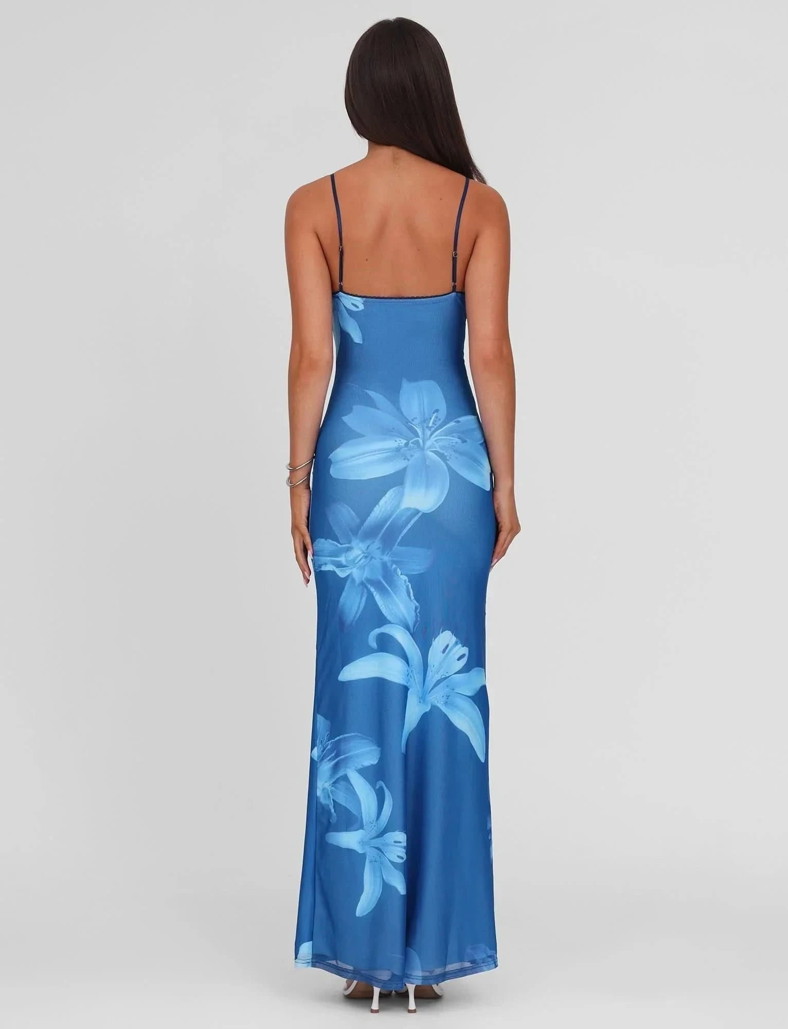 Blue floral wedding guest maxi dress back view with spaghetti straps