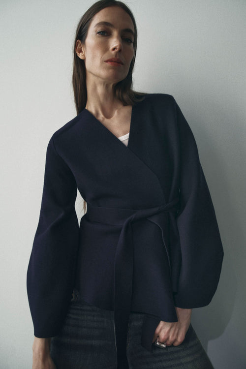 Navy wrap cardigan with long sleeves and tie waist closure