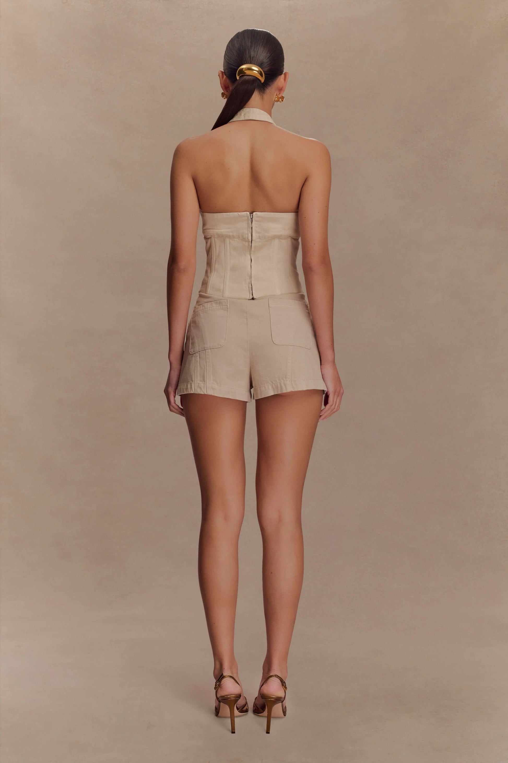 Beige halter crop top and shorts denim set back view