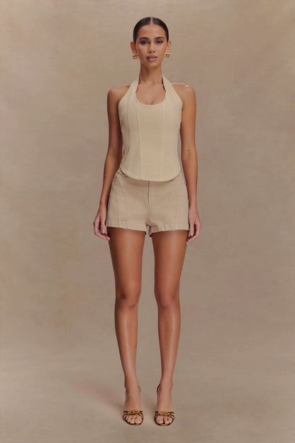Beige sleeveless halter crop top with tailored shorts set