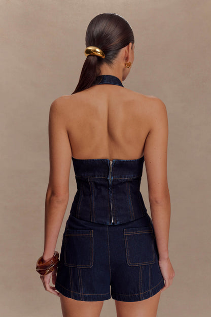 Back view of dark indigo denim halter top with open back design