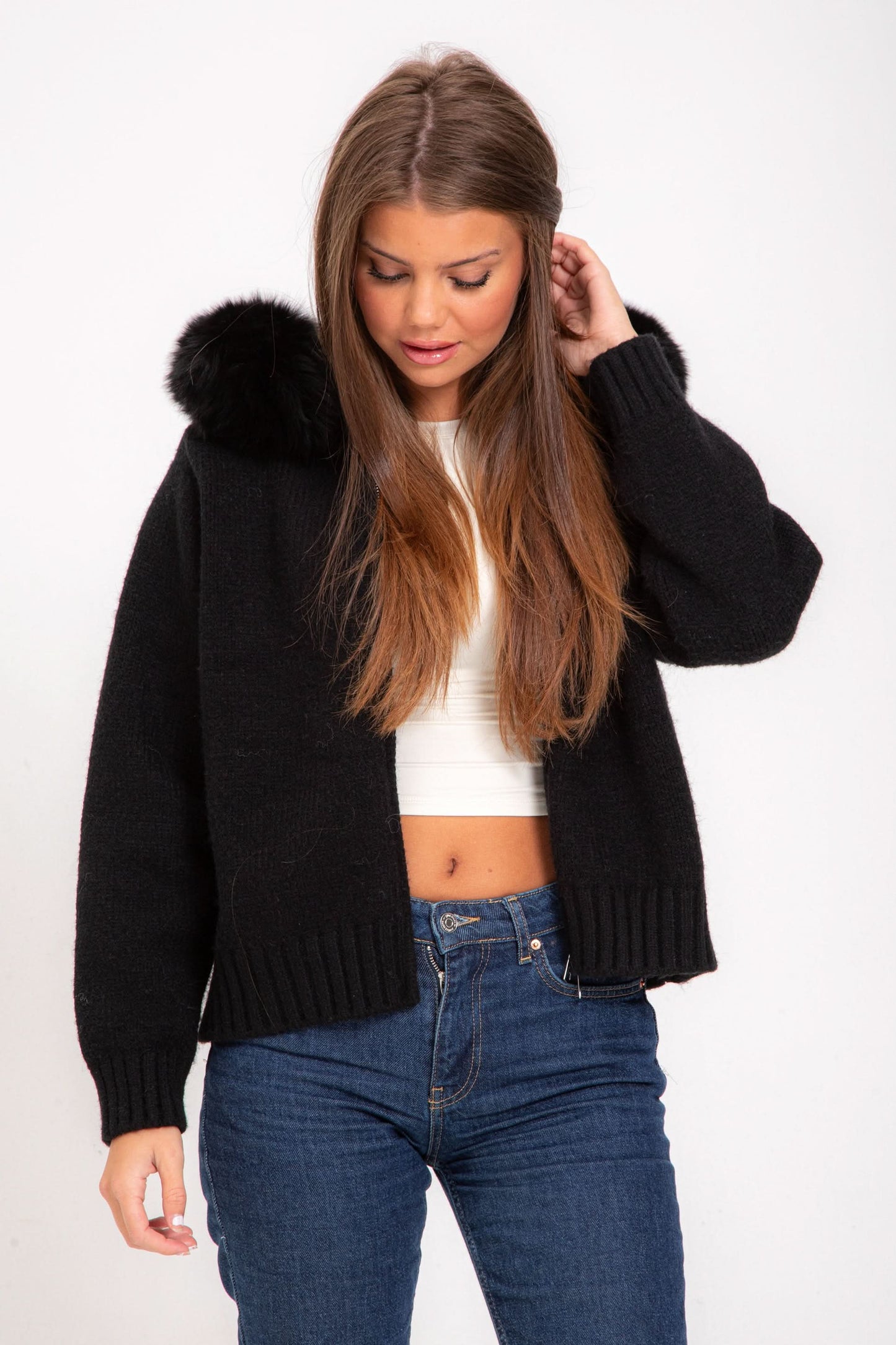 Black knit cardigan with fur collar trim, front view