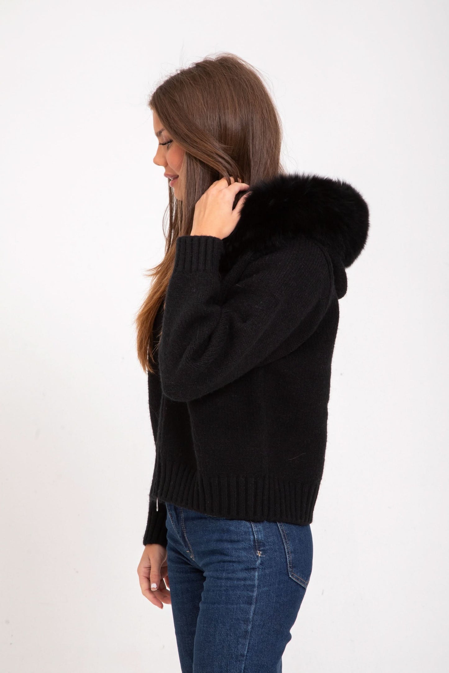Black knit cardigan with fur collar, side profile view
