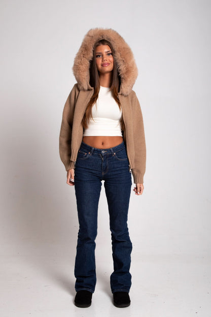Beige knit cardigan with oversized fur-lined hood, front view