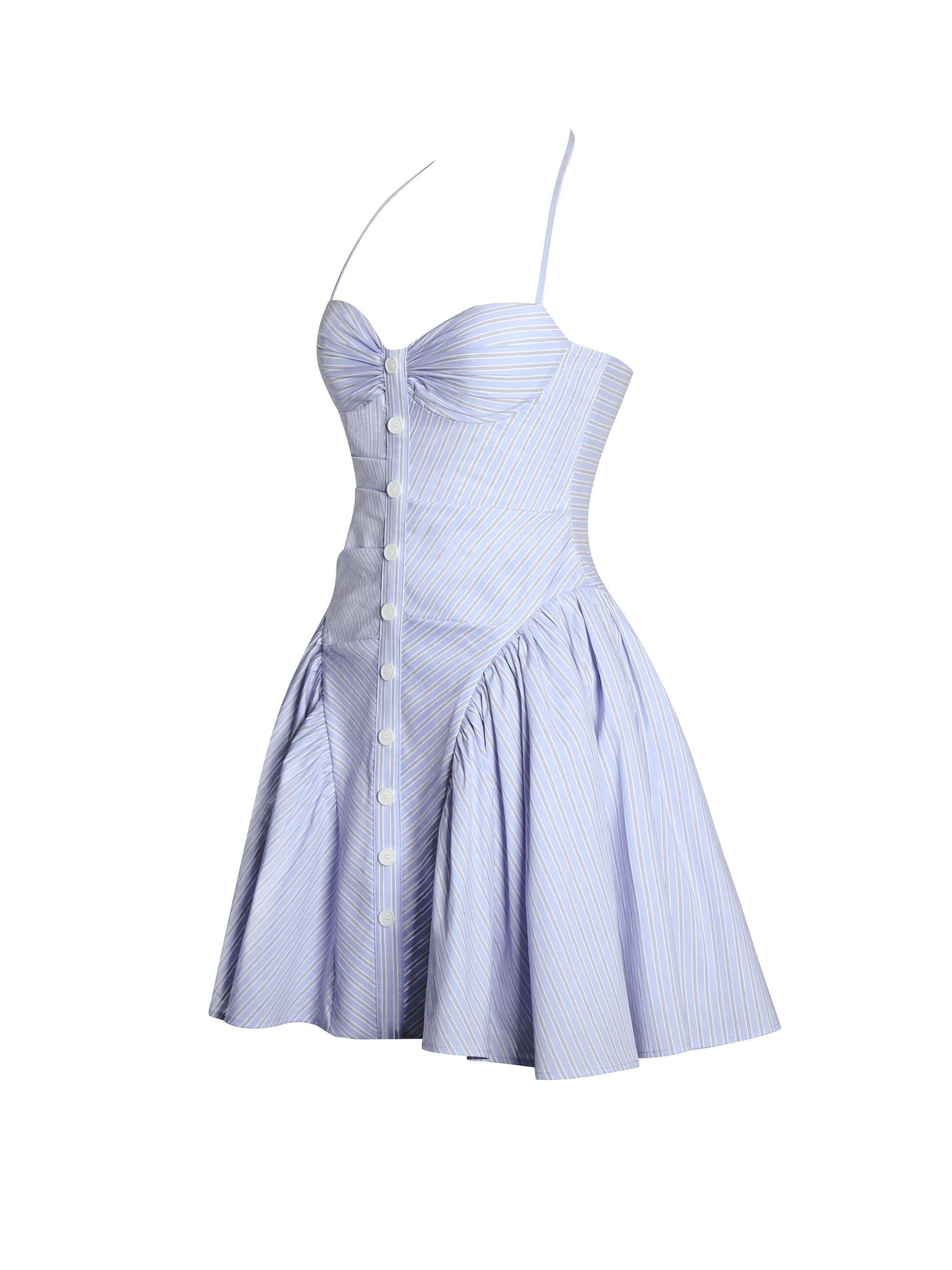 Side view of blue pinstriped mini dress with halter straps and button front
