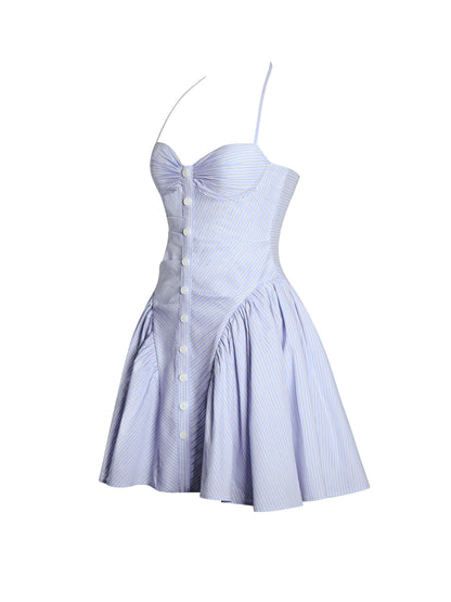 Side view of blue pinstriped mini dress with halter straps and button front