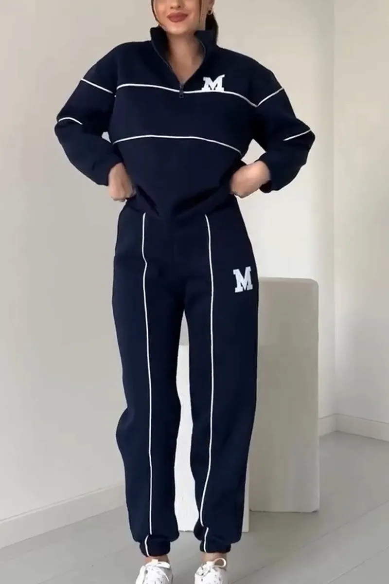 Navy blue tracksuit with white side stripe detail