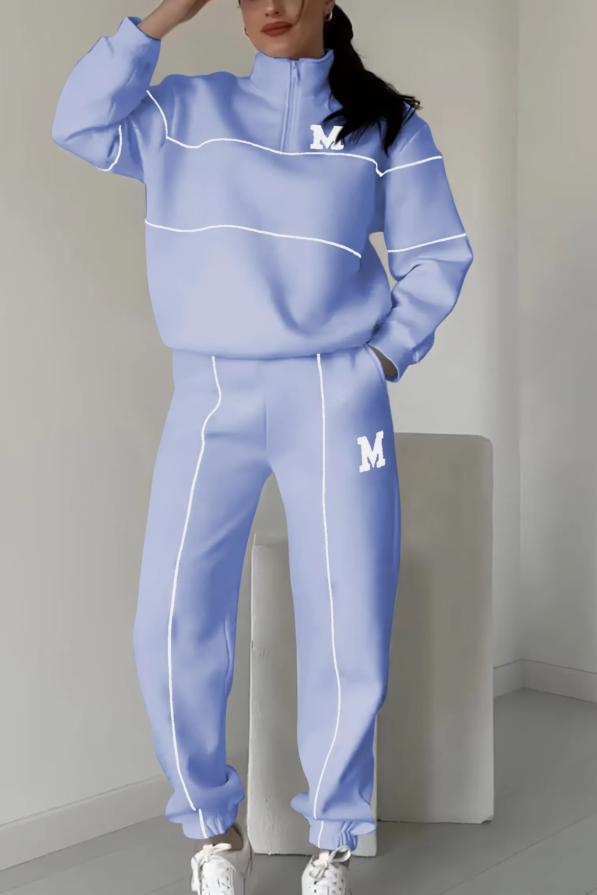 Periwinkle blue tracksuit with white trim and M logo
