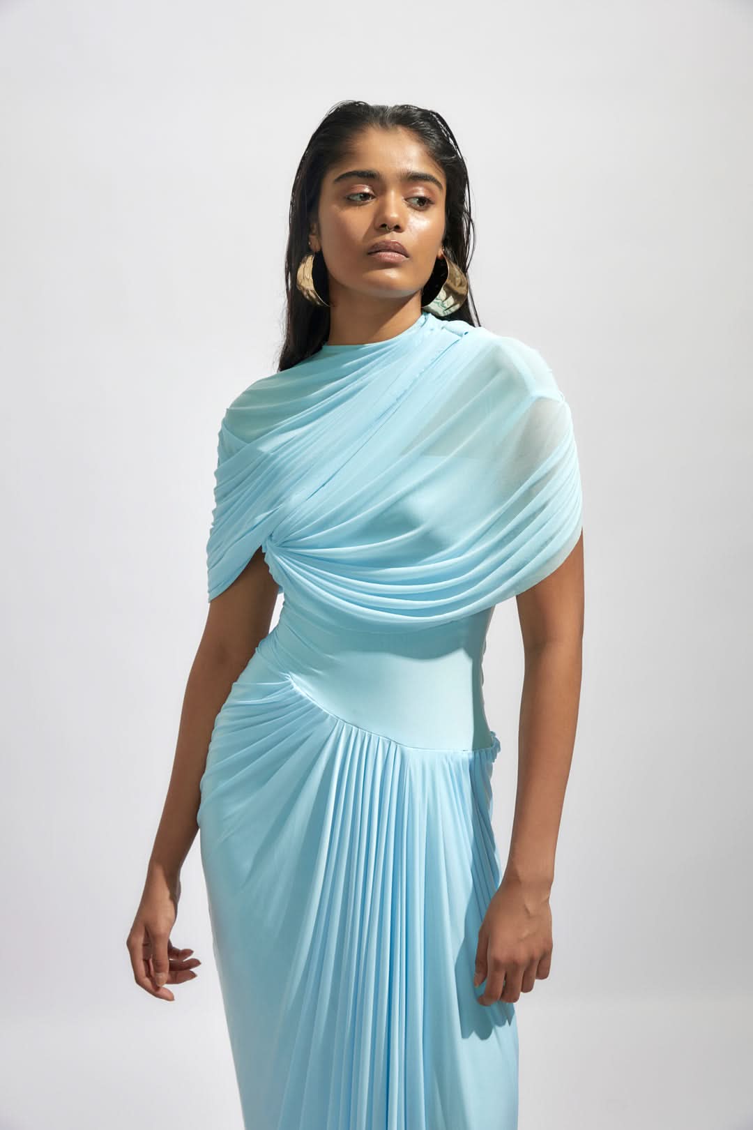 Close-up of light blue wrap maxi dress showing draped bodice detail