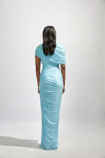Back view of light blue wrap maxi dress with ruched fabric and long train
