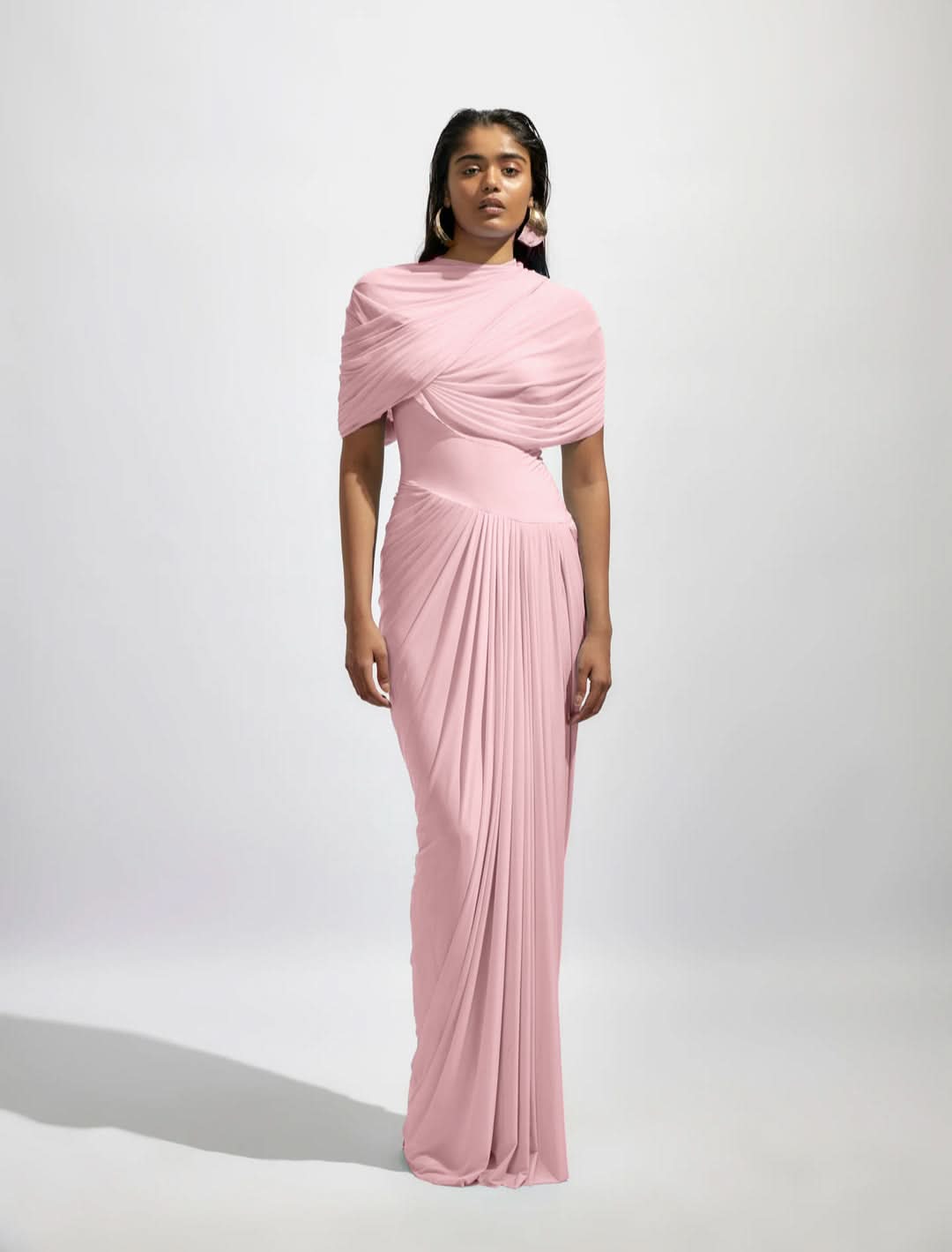 Blush pink wrap maxi dress with asymmetrical draped bodice and pleats
