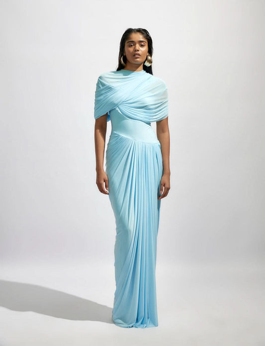 Light blue wrap maxi dress with draped shoulder overlay and pleated skirt