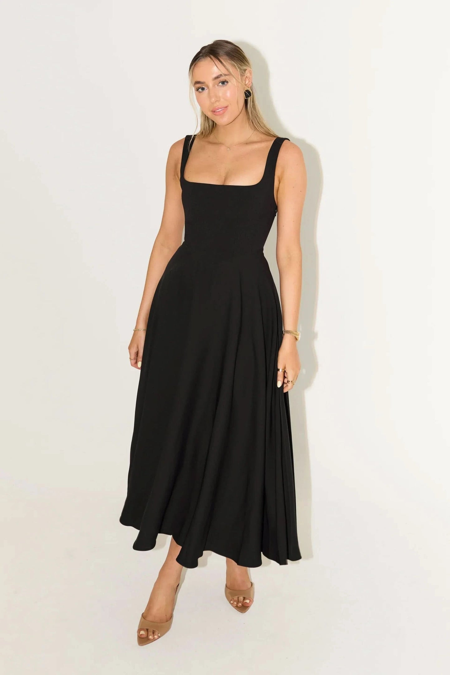 Black square-neck midi dress with sleeveless fit and full pleated skirt