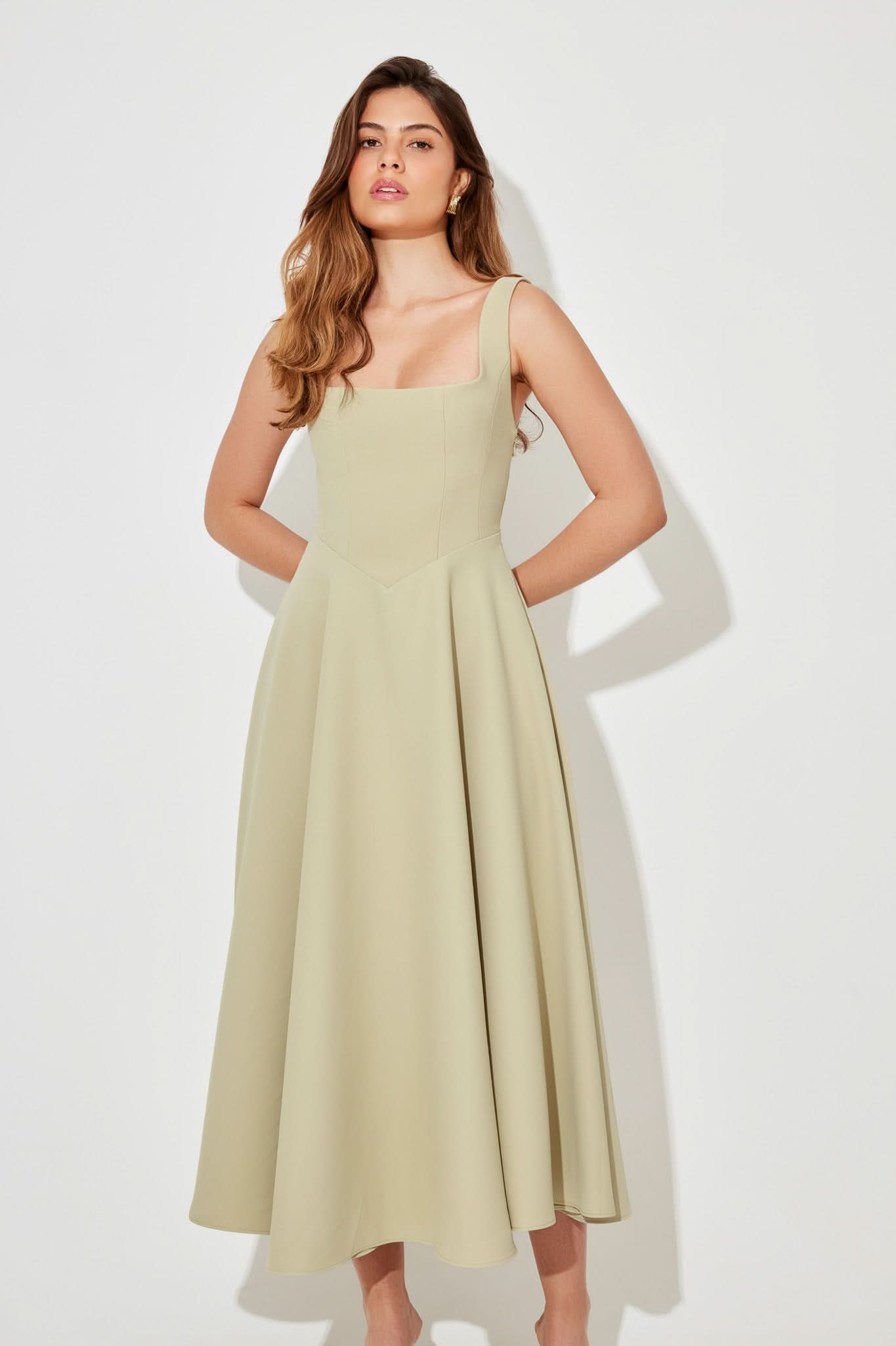 Pale yellow sleeveless square-neck midi dress with full pleated skirt