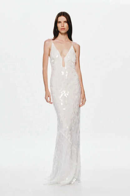 White sequin maxi dress with deep V-neckline and thin straps