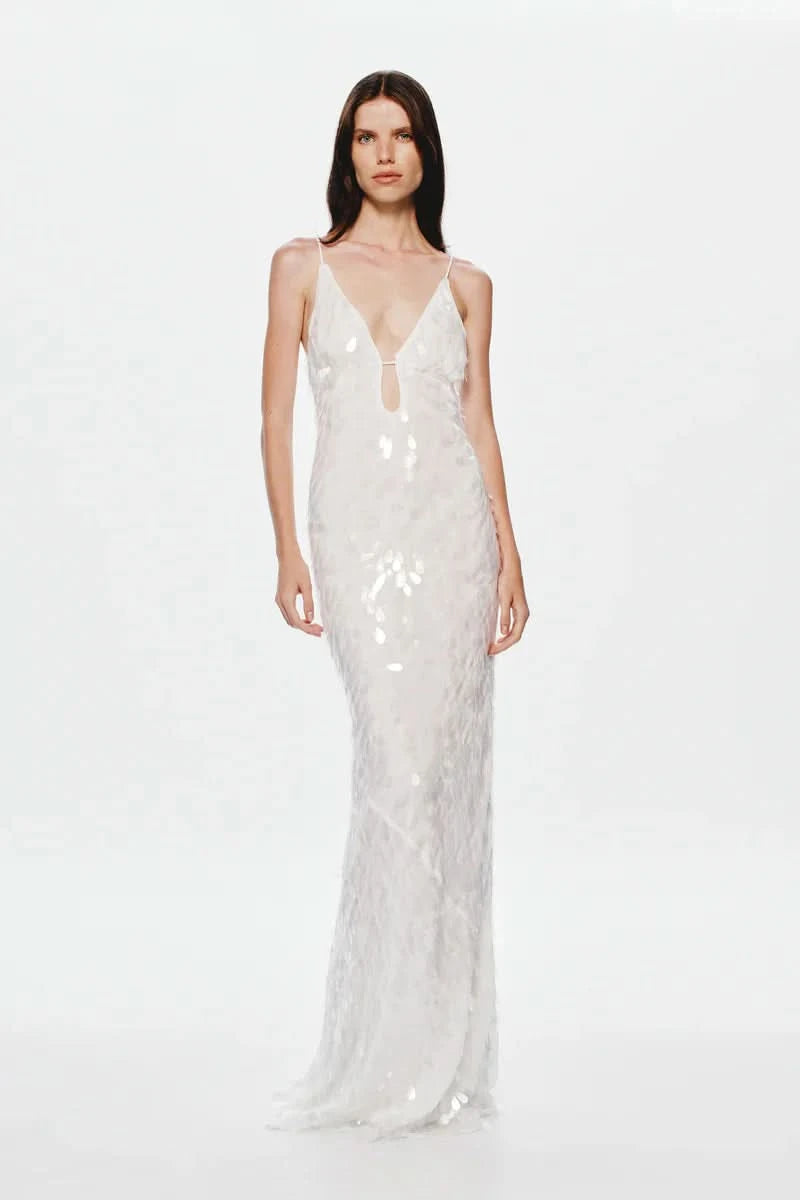 White sequin maxi dress with deep V-neckline and thin straps