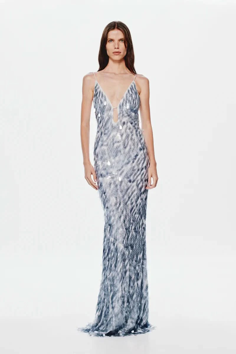 Blue and white patterned maxi dress with V-neck and flowing silhouette