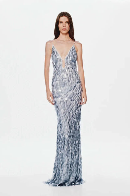 Blue and white patterned maxi dress with V-neck and flowing silhouette