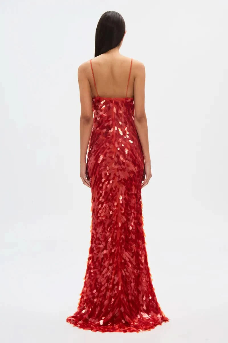 Back view of red sequin maxi dress with thin crisscross straps