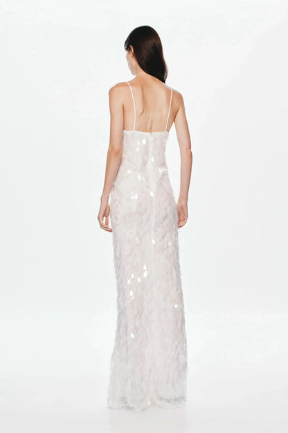 Back view of cream sequined maxi dress with low back design