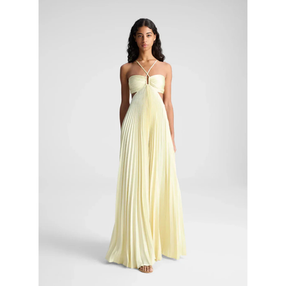 Pale yellow halter maxi dress with pleated skirt and cutout waist