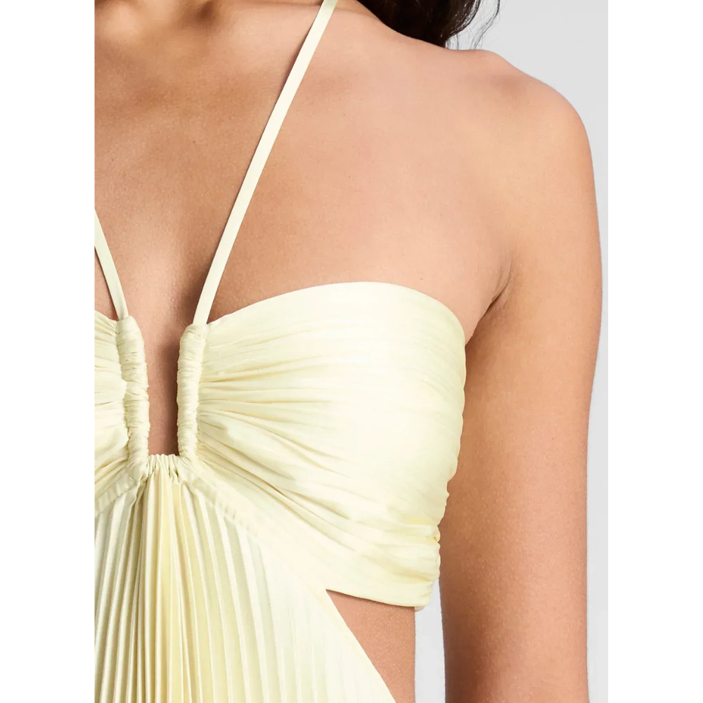 Pale yellow halter dress close-up of ruched bust and pleated fabric