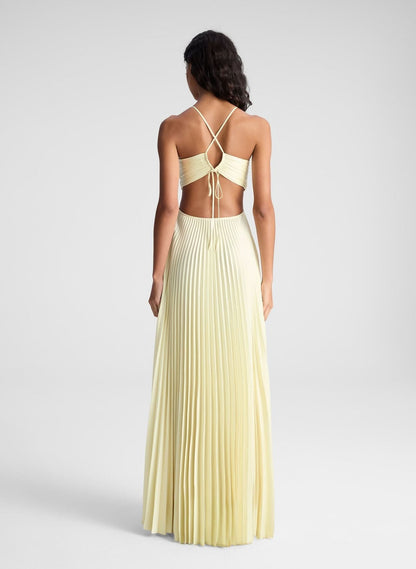 Back view of cream halter maxi dress showing tied straps and open back