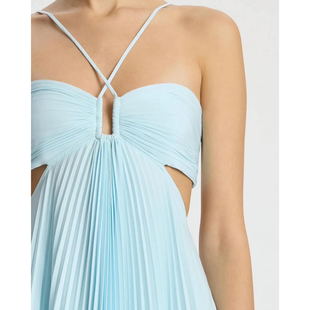 Close-up of light blue halter neckline with crossed straps and pleated bodice detail