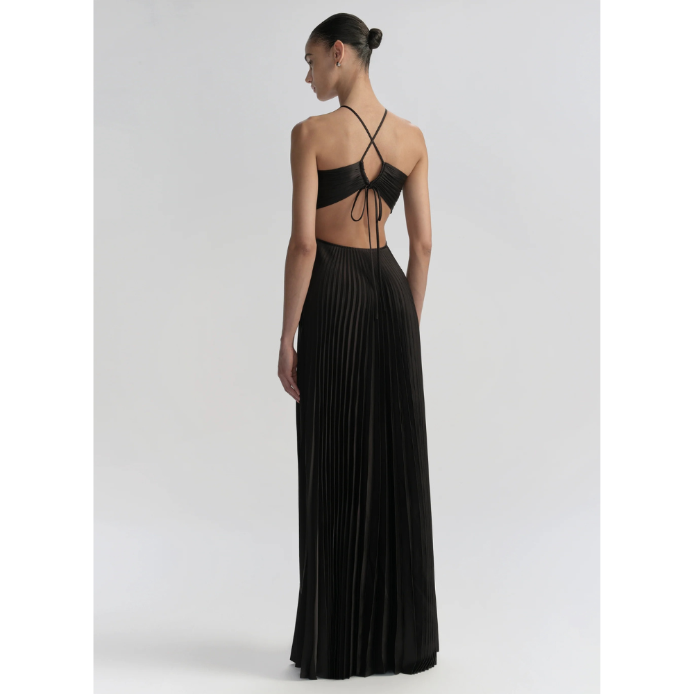 Back view of black halter maxi dress showing tied halter straps and open back design
