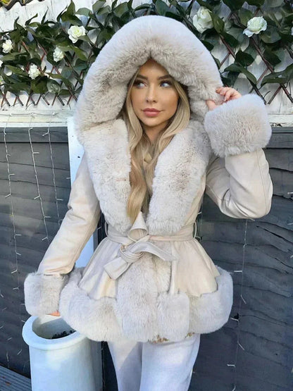 Cream faux fur coat with large hood and matching belt worn outdoors