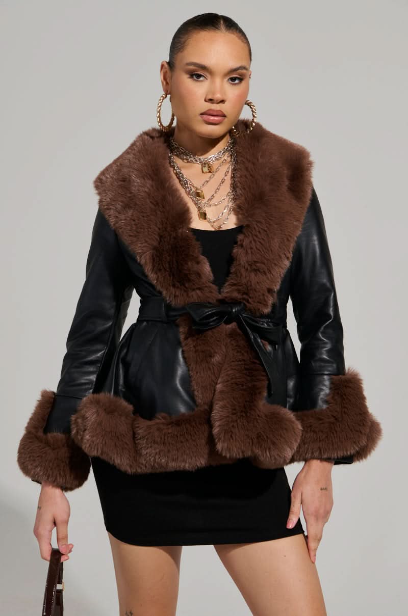 Brown faux fur collar and cuff trim on black leather jacket with belt