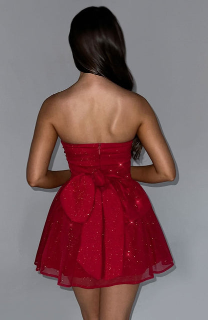 Back view of red sparkle mini dress with gathered tulle