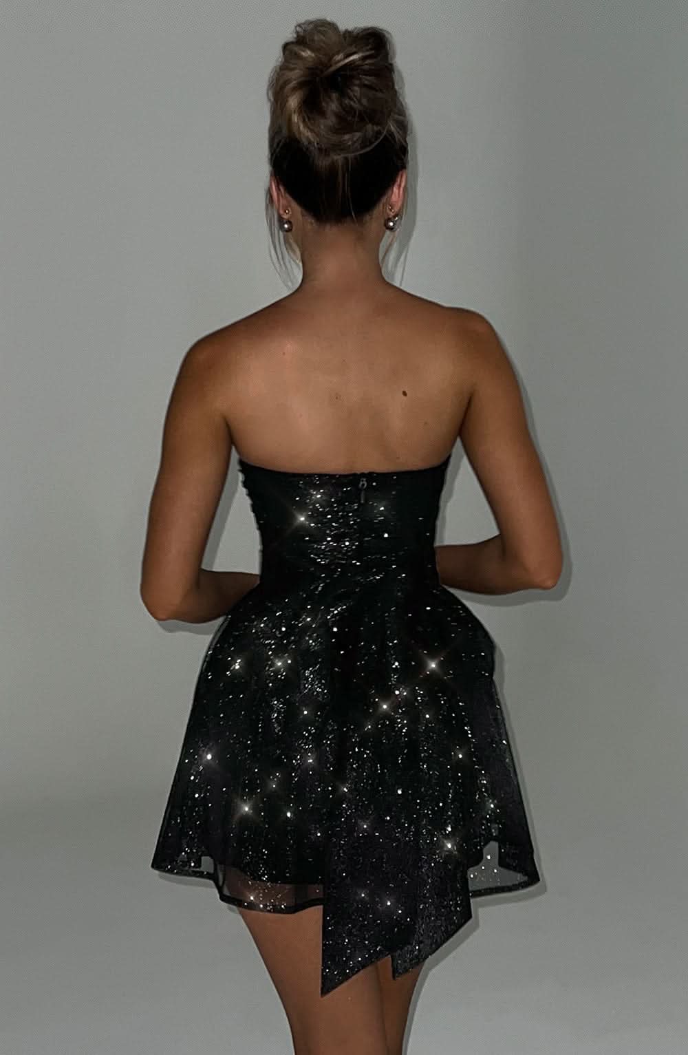 Black sequin strapless dress with asymmetrical tulle hem