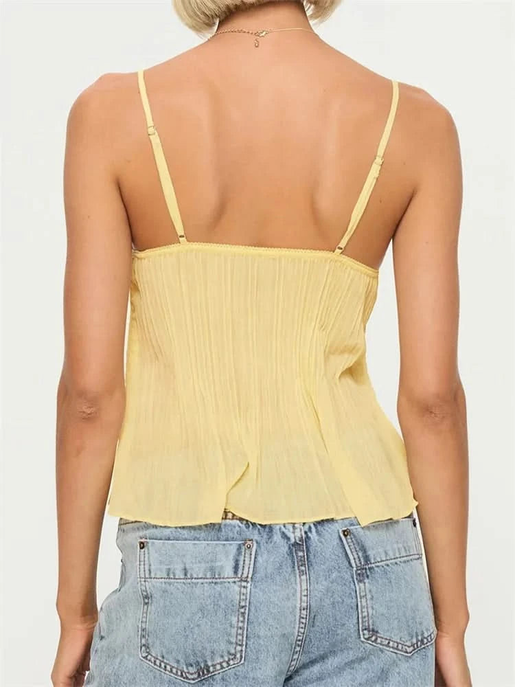 Back view of yellow pleated camisole with adjustable straps