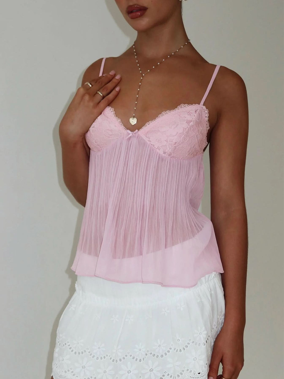 Pink pleated camisole with lace sweetheart neckline and spaghetti straps