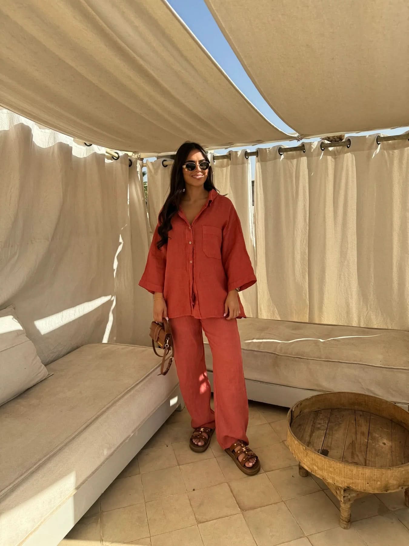 Rust-red linen shirt and straight-leg pants coordinate