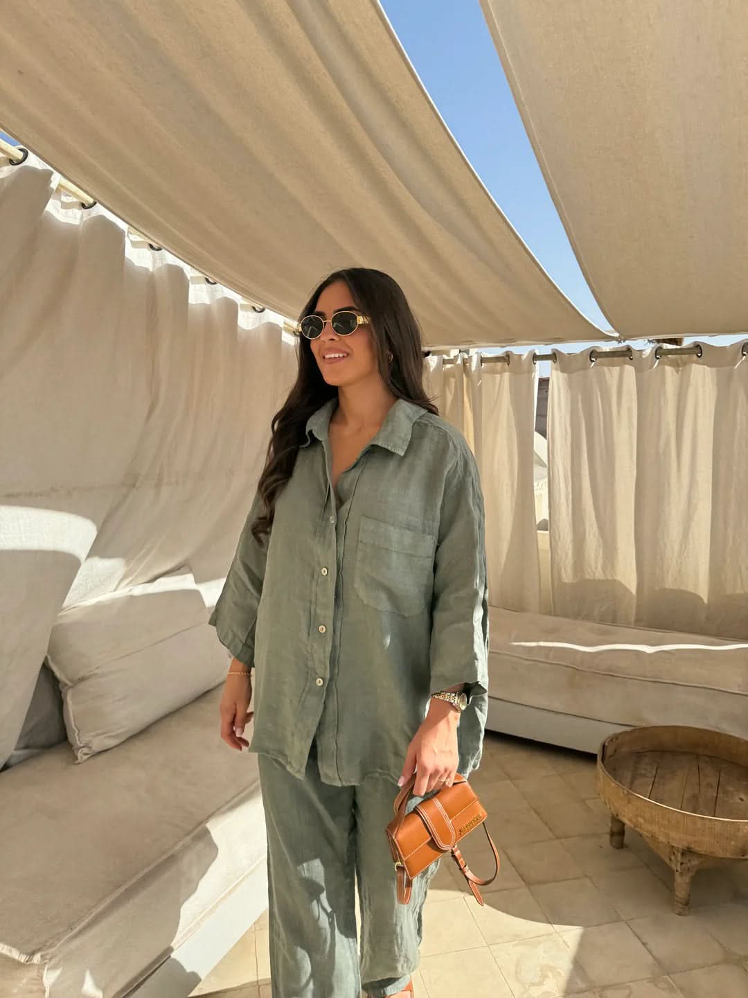 Sage green linen shirt with chest pocket and full-length matching linen trousers