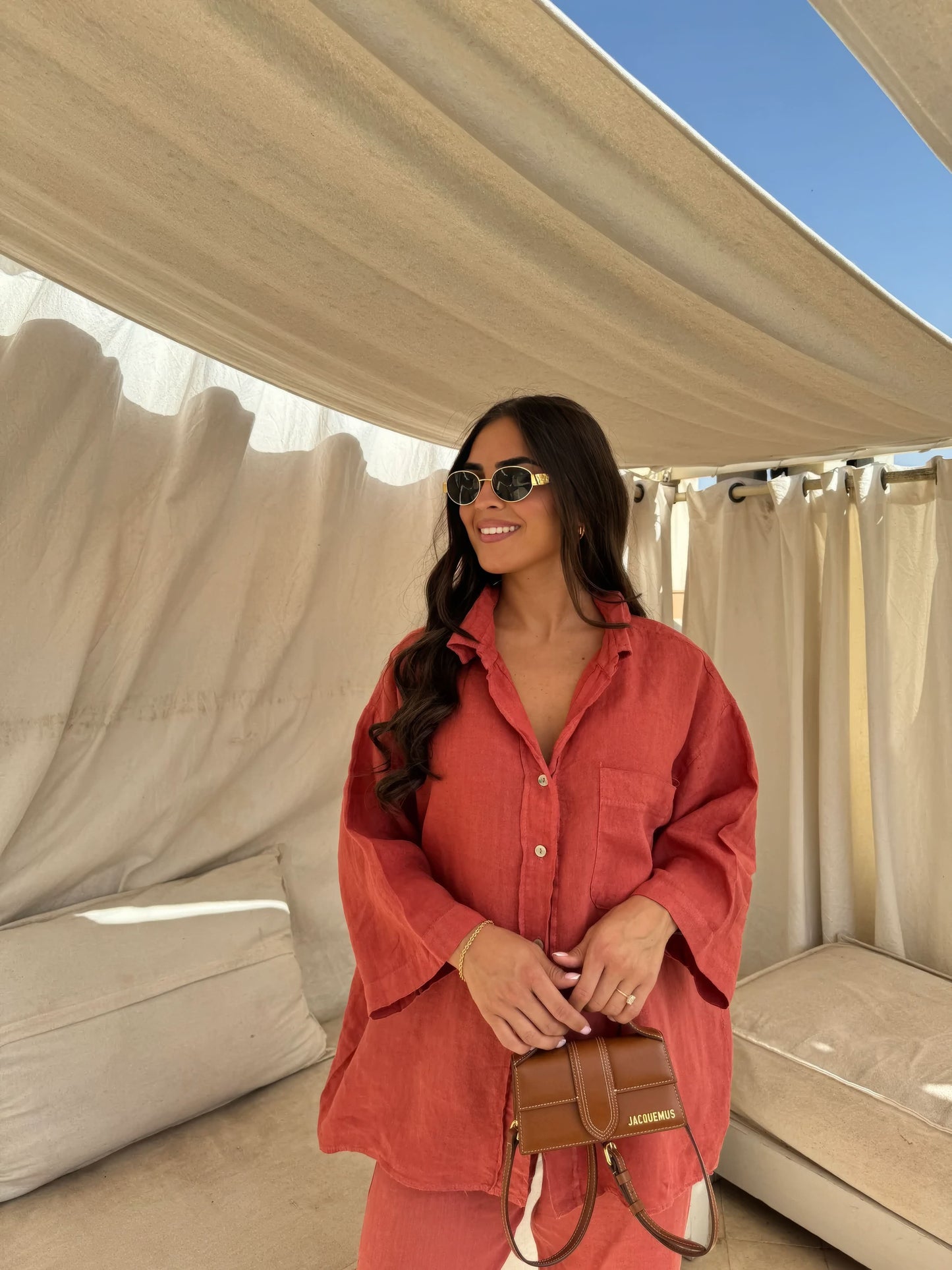 Coral red linen shirt and pants set with relaxed button-up silhouette